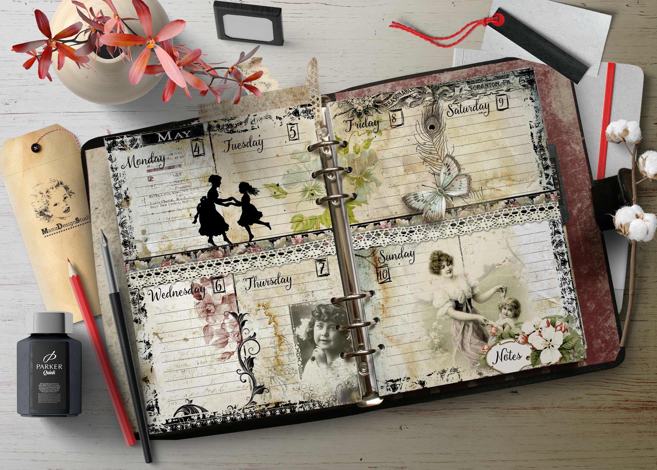 Open scrapbook planner with floral pages, vintage butterfly designs, and handwritten day headers across a ring-bound spread.