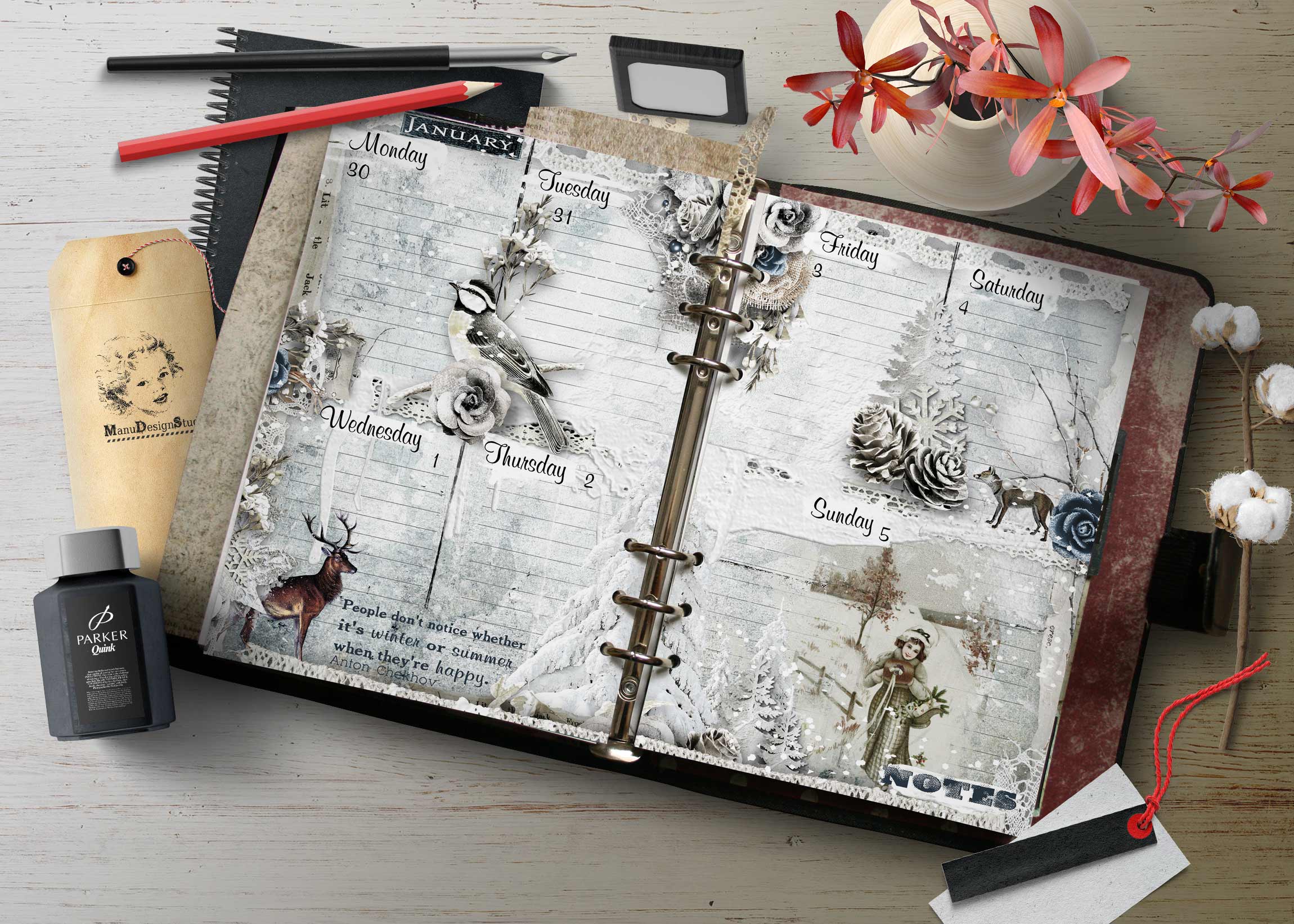 Flat lay of a decorative planner with illustrated winter motifs, days of the week visible, surrounded by pens, a tag, and a ink bottle on a light wooden surface with pink flowers in a vase nearby