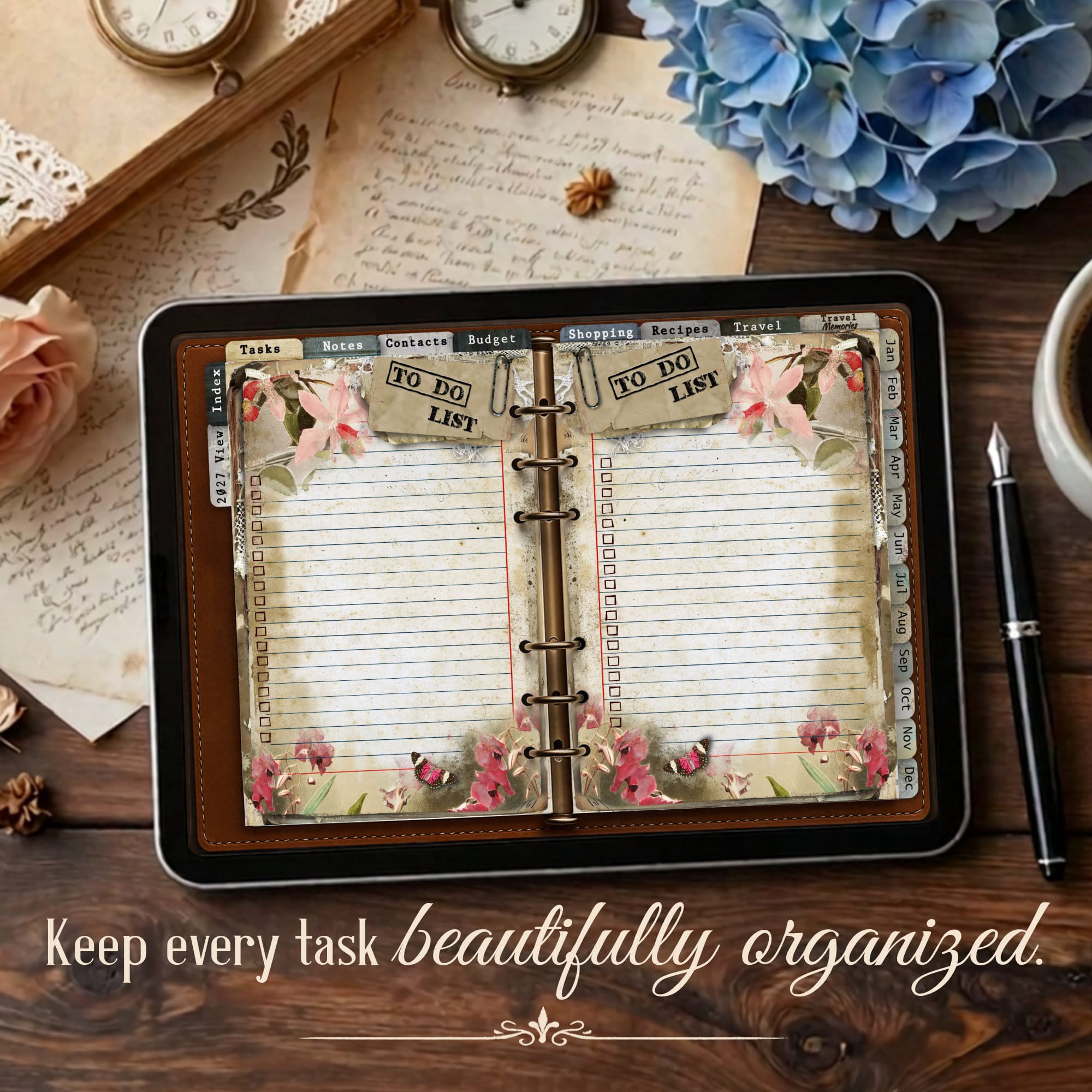 Open vintage digital planner with floral decorations showing to do list pages and calendar tabs on a wooden desk, blue hydrangeas nearby.