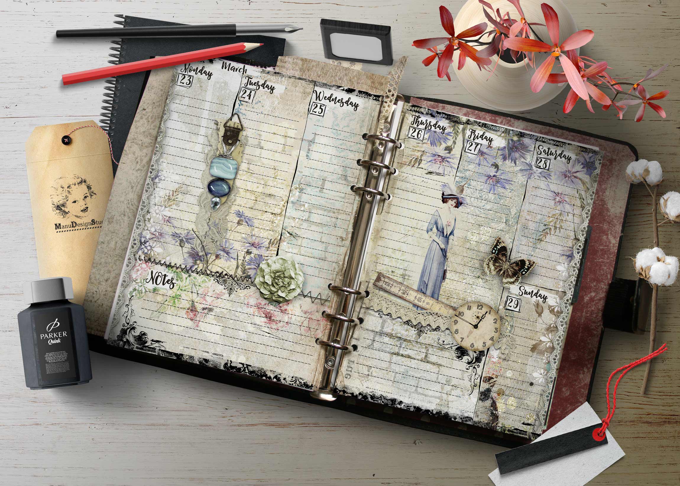 Flat lay of a decorative planner open to weekly pages with flowers and craft supplies, ink bottle, and a vase of pink flowers.
