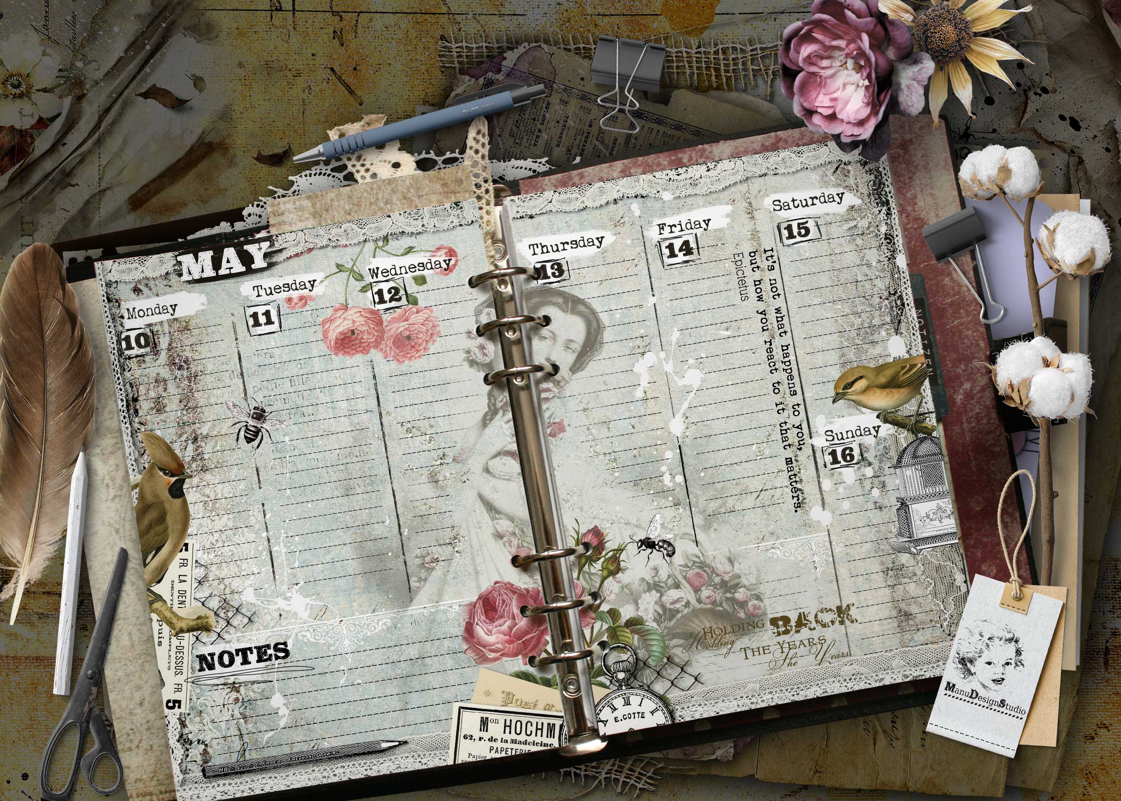 Open vintage-style planner with May calendar pages, lace trim, flowers, and office supplies scattered around. A5 weekly planner spread with vintage floral illustrations and antique details